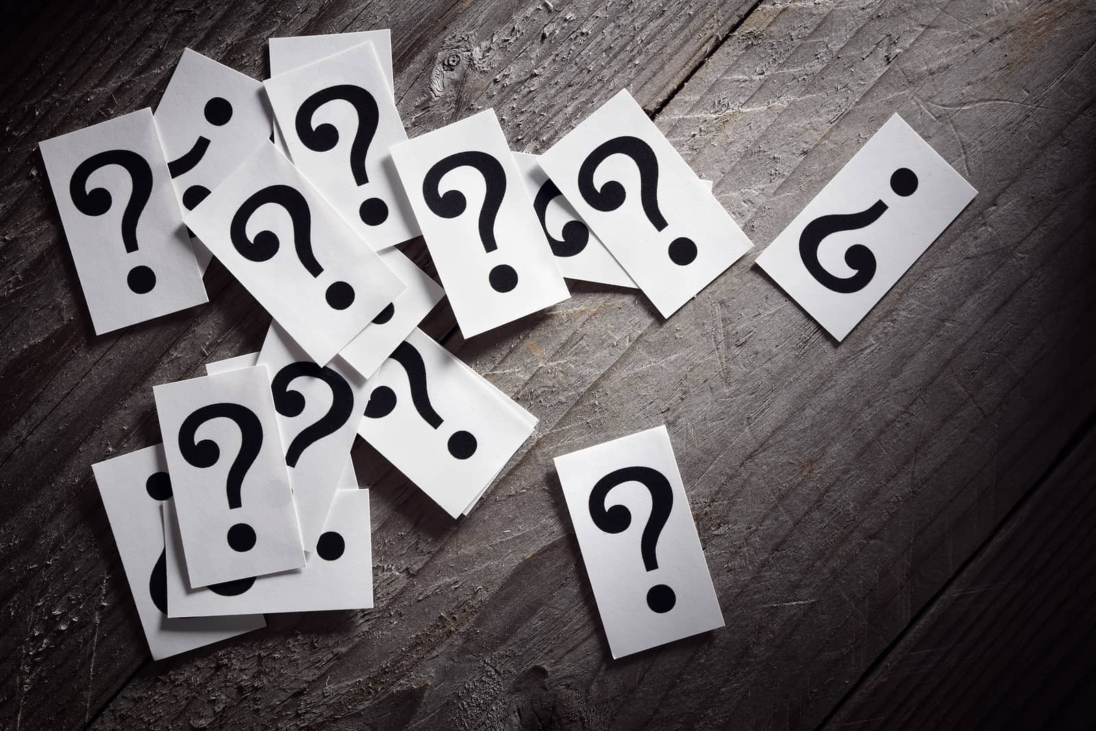 Question mark heap on table concept for confusion, question or s