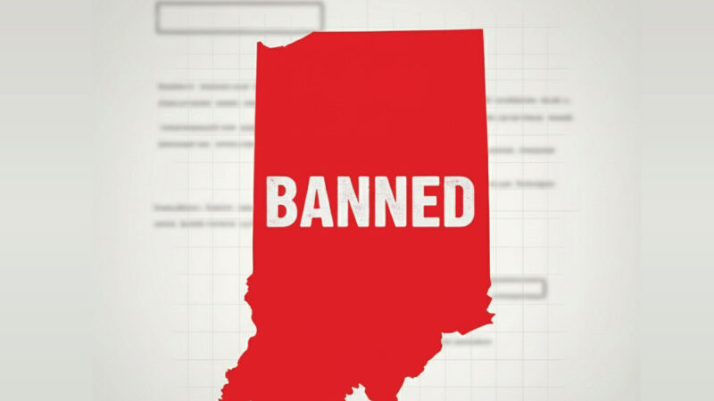 A red silhouette of the state of Indiana with the word BANNED in bold white letters across it, set against a blurred background with faint text and rectangles.