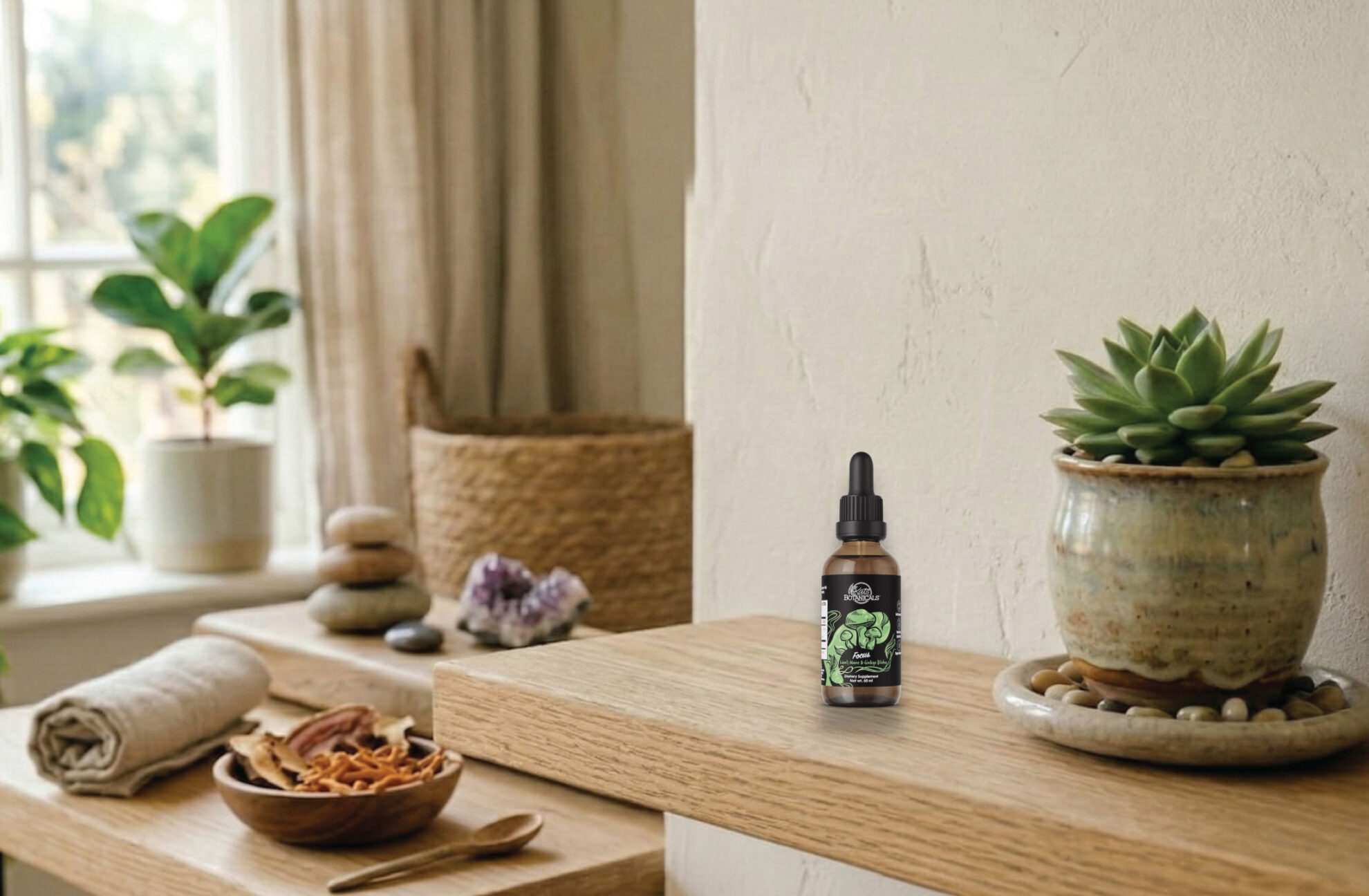 A small dropper bottle with a green label is placed on a wooden shelf next to a potted succulent. The background features a bright, cozy room with towels, stacked stones, a basket, and green plants.