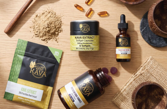 A selection of Kat’s Kava products, including capsules, powder, tincture, extract, and gummies, arranged on a wooden surface with bowls and a wooden spoon.