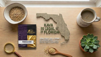 A bag of Kava powder sits on a table next to a bowl of dried Kava root, a cup of tea, a wooden spoon, and a cutout map of Florida with text stating that Kava is legal in Florida.